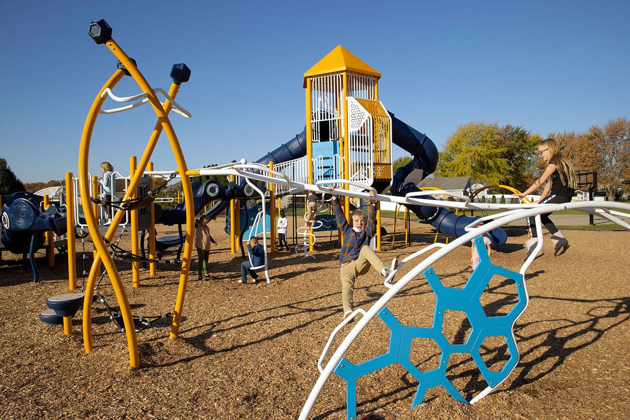 Kids playing on Climbers and tower structure